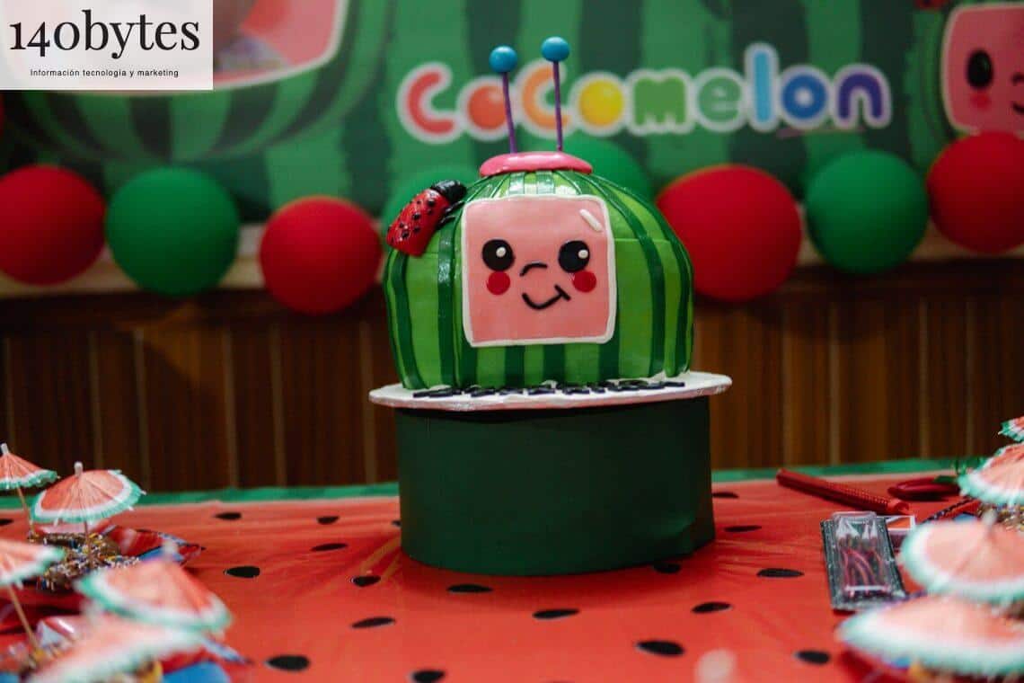 A cocomelon themed cake is displayed